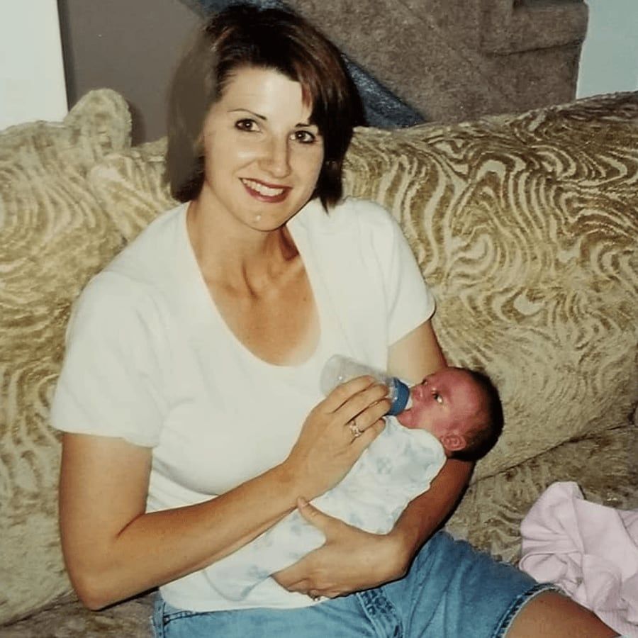 Suzanne holding Lillie as a newborn in 2003.
